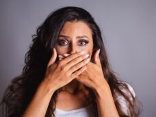 brazilian-woman-brown-hair-scared-domestic-violence-fight-against-femicide-hands-mouth-silence_579344-14330.jpg