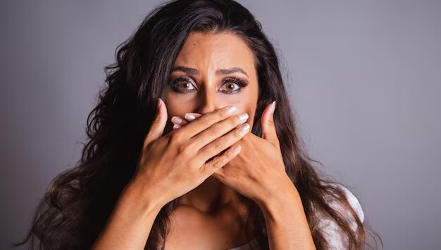 brazilian-woman-brown-hair-scared-domestic-violence-fight-against-femicide-hands-mouth-silence_579344-14330.jpg